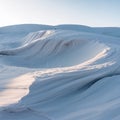 Snow Dunes with Wind Shaped Patterns in Bright Daylight Royalty Free Stock Photo