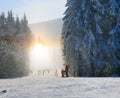 Snow dust dazzle shining on winter skiing slope Royalty Free Stock Photo