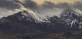Snow Dusted Mountain Range Capped in Clouds Royalty Free Stock Photo