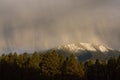 Snow falling on mountains at sunset. Flagstaff, Arizona. Royalty Free Stock Photo