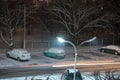 Snow falling night against the background of a lamppost