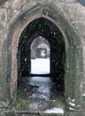 Snow falling in the ruins of heptonstall church doorway