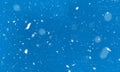 Snow falling winter background on blue