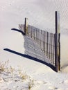 Snow fence with shadow Royalty Free Stock Photo