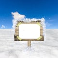 Snow field and blue sky with wooden sign board Royalty Free Stock Photo