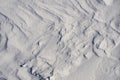 Snow fields covered with intricate patterns from the wind, a copy space, close-up.