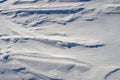 Snow fields covered with intricate patterns from the wind, a copy space, close-up.