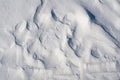 Snow fields covered with intricate patterns from the wind, a copy space, close-up.