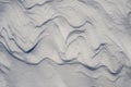 Snow fields covered with intricate patterns from the wind, a copy space, close-up. Royalty Free Stock Photo