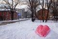 Snow figure created as a heart symbol to mark Valentine`s day