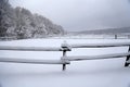 Snow filled horse corral winter time without horses Royalty Free Stock Photo