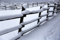 Snow filled horse corral winter time without horses. Shallow depth of field Royalty Free Stock Photo