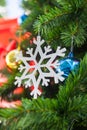 Snow flake and Shatterproof ball ornament on Christmas Tree Royalty Free Stock Photo