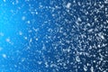 Snow flakes falling on blue background Royalty Free Stock Photo