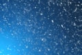 Snow flakes falling on blue background Royalty Free Stock Photo