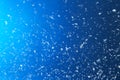 Snow flakes falling on blue background Royalty Free Stock Photo