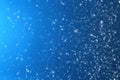 Snow flakes falling on blue background Royalty Free Stock Photo