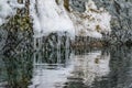 Snow flows into icicles on winter day Royalty Free Stock Photo