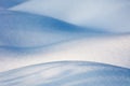 Soft midwinter light and shadows on fresh snow Royalty Free Stock Photo