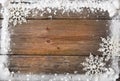 Snow frame with snowflakes over wooden background, copy space Royalty Free Stock Photo