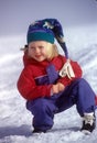 Snow Girl In Snowsuit And Cap Royalty Free Stock Photo