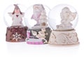 Snow globe with angels, Santa Claus on a ceramic base. Royalty Free Stock Photo