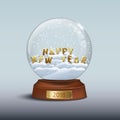 Snow globe with 2018 Happy New Year signs. HAPPY NEW YEAR letters inside snow globe and golden badge with 2018 number on