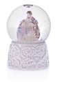 Snow globe with holy Mary, baby Jesus and Joseph on a ceramic ba