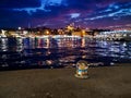 Snow globe of Istanbul against the night landscape of the Golden Horn Bay and lights of Suleymaniye Mosque. The concept of