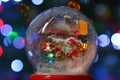 Snow globe with Santa Claus near house with street illumination Royalty Free Stock Photo