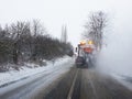 Snow gritter sprinkle salt on the road