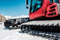 Snow grooming machine Ratrak. Winter mountain landscape.