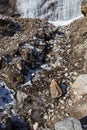 Snow on the ground with clay, grass and stone at Lachen. North Sikkim, India