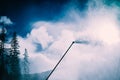 Snow gun, snow making process on a ski slope. Climate control wi