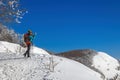 Snow hiker in the mountains, middle aged woman