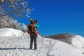 Snow hiker in the mountains, middle aged woman