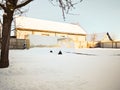 Snow house in winter world at dawn in forest old weather and a lot of snow on roof