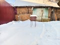 Snow house in winter world at dawn in forest old weather and a lot of snow on roof