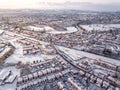 Aerial view of snowed in traditional housing suburbs in England.
