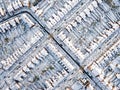 Aerial view of snowed in traditional housing suburbs in England.