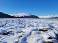 Snowy mudflats, Turnagain Arm, outside of Girdwood, Alaska on a clear winter day.