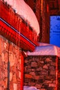 Snow ice falling from chalet mountain roof in ski resort Tignes France Royalty Free Stock Photo