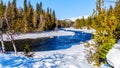 Snow and ice lining the Murtle River in winter time in the Cariboo Mountains of Wells Gray Provincial Park