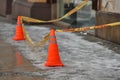 Snow and icicles falling down from a building rood warning tape Royalty Free Stock Photo