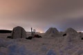 Snow igloo on the frozen sea on a background of the Northern Lights Royalty Free Stock Photo