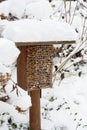 Snow at insect hotel with wild bees and wesps Royalty Free Stock Photo