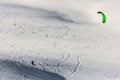 Snow kite in powder snow in Passo Giau, high alpine pass near Cortina d`Ampezzo, Dolomites, Italy