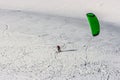 Snow kite in powder snow in Passo Giau, high alpine pass near Cortina d`Ampezzo, Dolomites, Italy