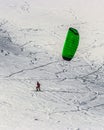 Snow kite in powder snow in Passo Giau, high alpine pass near Cortina d`Ampezzo, Dolomites, Italy
