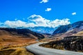 Snow landscape in Drakensberg mountains in Underberg South Africa under blue sky and flakey clouds